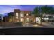 Contemporary home with desert landscaping, a spacious driveway, and a modern glass garage door at 3740 Caesars Cir, Las Vegas, NV 89120
