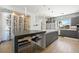 Modern kitchen featuring sleek countertops, stainless steel appliances, and ample storage space, with a wine room at 3740 Caesars Cir, Las Vegas, NV 89120