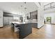 Modern kitchen with stainless steel appliances, large island, and sleek gray cabinetry at 3740 Caesars Cir, Las Vegas, NV 89120