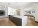Spacious kitchen with island, adjacent to a dining area and living room at 3740 Caesars Cir, Las Vegas, NV 89120