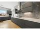 Contemporary kitchen showcasing sleek gray cabinets and stainless steel range hood at 3740 Caesars Cir, Las Vegas, NV 89120