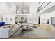 Spacious living area with high ceilings, modern decor, and seamless flow to the kitchen and dining areas at 3740 Caesars Cir, Las Vegas, NV 89120