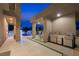 Outdoor kitchen with stainless steel appliances, a built-in grill, and a dining area overlooking the pool at 3740 Caesars Cir, Las Vegas, NV 89120