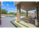 Inviting outdoor dining area next to a sleek pool and landscaped yard at 3740 Caesars Cir, Las Vegas, NV 89120