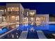 Luxurious outdoor living space featuring a sparkling pool, modern lounge chairs, and elegant architecture at 3740 Caesars Cir, Las Vegas, NV 89120