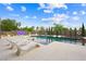 Backyard oasis featuring a modern pool, spa, and sleek lounge chairs under a bright sky at 3740 Caesars Cir, Las Vegas, NV 89120
