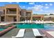 Relaxing pool area with in-water lounge chairs and views of the home's modern architecture at 3740 Caesars Cir, Las Vegas, NV 89120