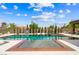 Stunning pool area with a spa, comfortable seating, and professionally designed landscaping and decor at 3740 Caesars Cir, Las Vegas, NV 89120