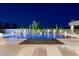 Stunning pool area with elegant lounge chairs, manicured landscaping, and ambient lighting for evening enjoyment at 3740 Caesars Cir, Las Vegas, NV 89120