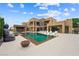 Resort-style backyard with a modern pool, elegant lounge seating, and seamless indoor-outdoor living at 3740 Caesars Cir, Las Vegas, NV 89120