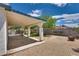 Covered patio and a well-maintained backyard offering an ideal space for outdoor relaxation at 3811 Twinkle Star Dr, Las Vegas, NV 89115