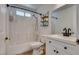 Bathroom featuring a shower over tub, floating shelves, and modern fixtures at 3811 Twinkle Star Dr, Las Vegas, NV 89115