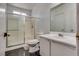 Bathroom featuring a shower with glass sliding doors and an integrated vanity at 3811 Twinkle Star Dr, Las Vegas, NV 89115