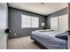 Bedroom with gray walls, plush carpet, a bed, and natural light from window at 3811 Twinkle Star Dr, Las Vegas, NV 89115