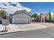 A charming home with a well-maintained front yard and spacious driveway, on a sunny day at 3811 Twinkle Star Dr, Las Vegas, NV 89115