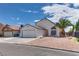 Charming single-story home featuring a well-maintained front yard and an attached two-car garage at 3811 Twinkle Star Dr, Las Vegas, NV 89115