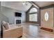 Bright living room featuring a fireplace, large window, and neutral tones at 3811 Twinkle Star Dr, Las Vegas, NV 89115