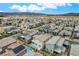 High angle view showing a neighborhood filled with modern homes set against a mountainous backdrop at 4177 Railhead Pass Ave, Las Vegas, NV 89141