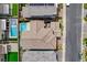 A high-angle shot of a home with a well-maintained roof and a private backyard pool area at 4177 Railhead Pass Ave, Las Vegas, NV 89141