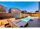 Serene backyard with a sleek pool, a sun-soaked lounge area and manicured landscaping for outdoor living at 4177 Railhead Pass Ave, Las Vegas, NV 89141