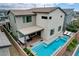 Backyard aerial view showcases the pool and patio area of this home at 4177 Railhead Pass Ave, Las Vegas, NV 89141