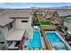 Backyard aerial view featuring a blue pool and covered patio seating at 4177 Railhead Pass Ave, Las Vegas, NV 89141