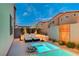 Inviting backyard featuring a modern pool, a relaxing spa and cozy lounge chairs for ultimate comfort at 4177 Railhead Pass Ave, Las Vegas, NV 89141