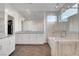 Luxurious bathroom with a glass-enclosed shower, double vanity, and tile flooring at 4177 Railhead Pass Ave, Las Vegas, NV 89141