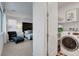 Cozy bedroom connected to a laundry room featuring a modern washing machine, making chores convenient and efficient at 4177 Railhead Pass Ave, Las Vegas, NV 89141