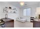 Bright bedroom with decor and a sleek light fixture, perfect for relaxation at 4177 Railhead Pass Ave, Las Vegas, NV 89141