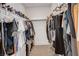 Organized walk-in closet with ample shelving and hanging space for clothes and shoes, maximizing storage efficiency at 4177 Railhead Pass Ave, Las Vegas, NV 89141