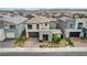 A modern two-story home featuring a well-kept front yard with mature landscaping at 4177 Railhead Pass Ave, Las Vegas, NV 89141