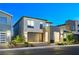 Modern two-story home featuring a neutral color palette, attached garage, and tidy front yard at 4177 Railhead Pass Ave, Las Vegas, NV 89141