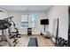 Home gym featuring exercise equipment, natural light, and wood-look flooring for fitness activities at 4177 Railhead Pass Ave, Las Vegas, NV 89141