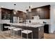 Large kitchen island with bar seating, stainless steel appliances and granite countertops at 4177 Railhead Pass Ave, Las Vegas, NV 89141