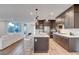 Contemporary kitchen with granite counters, stainless steel appliances, and a kitchen island with seating at 4177 Railhead Pass Ave, Las Vegas, NV 89141