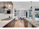 The kitchen features modern appliances, granite countertops, and sleek dark wood cabinetry at 4177 Railhead Pass Ave, Las Vegas, NV 89141