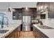 Close-up of kitchen features stainless steel appliances, granite counters, and modern cabinetry at 4177 Railhead Pass Ave, Las Vegas, NV 89141