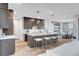 Spacious kitchen with dark cabinetry, granite countertops, and a breakfast bar with stools at 4177 Railhead Pass Ave, Las Vegas, NV 89141