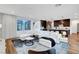 Bright living room features a plush white sectional sofa and open floor plan at 4177 Railhead Pass Ave, Las Vegas, NV 89141