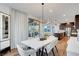 Bright and open concept living space combining dining and kitchen area for easy entertaining at 4177 Railhead Pass Ave, Las Vegas, NV 89141