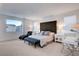 Main bedroom featuring white walls, a large window with a view, and a comfortable king bed at 4177 Railhead Pass Ave, Las Vegas, NV 89141
