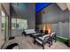 Cozy outdoor patio featuring modern furniture, a fire pit, and stylish decorative plants at 4177 Railhead Pass Ave, Las Vegas, NV 89141
