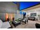Elegant outdoor living space featuring a BBQ, dining area, modern seating, and a fire pit at 4177 Railhead Pass Ave, Las Vegas, NV 89141