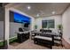 Well-equipped patio with a built-in grill, dining table, and comfortable seating for entertaining at 4177 Railhead Pass Ave, Las Vegas, NV 89141