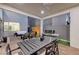 Relaxing covered patio with outdoor seating, dining table, and a built-in grill, perfect for entertaining at 4177 Railhead Pass Ave, Las Vegas, NV 89141