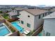 An aerial view of a backyard with a pool, sunbathing area, and landscaped walls, perfect for outdoor enjoyment at 4177 Railhead Pass Ave, Las Vegas, NV 89141
