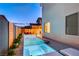 Modern pool with a stylish design, a cozy lounge area, and well-maintained landscaping for a tranquil escape at 4177 Railhead Pass Ave, Las Vegas, NV 89141