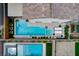 A top-down view of a pool and spa setup with manicured landscaping and adjacent patio space at 4177 Railhead Pass Ave, Las Vegas, NV 89141