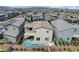 Aerial view of backyard featuring pool, patio area, and landscaped yard, perfect for outdoor living and entertaining at 4177 Railhead Pass Ave, Las Vegas, NV 89141